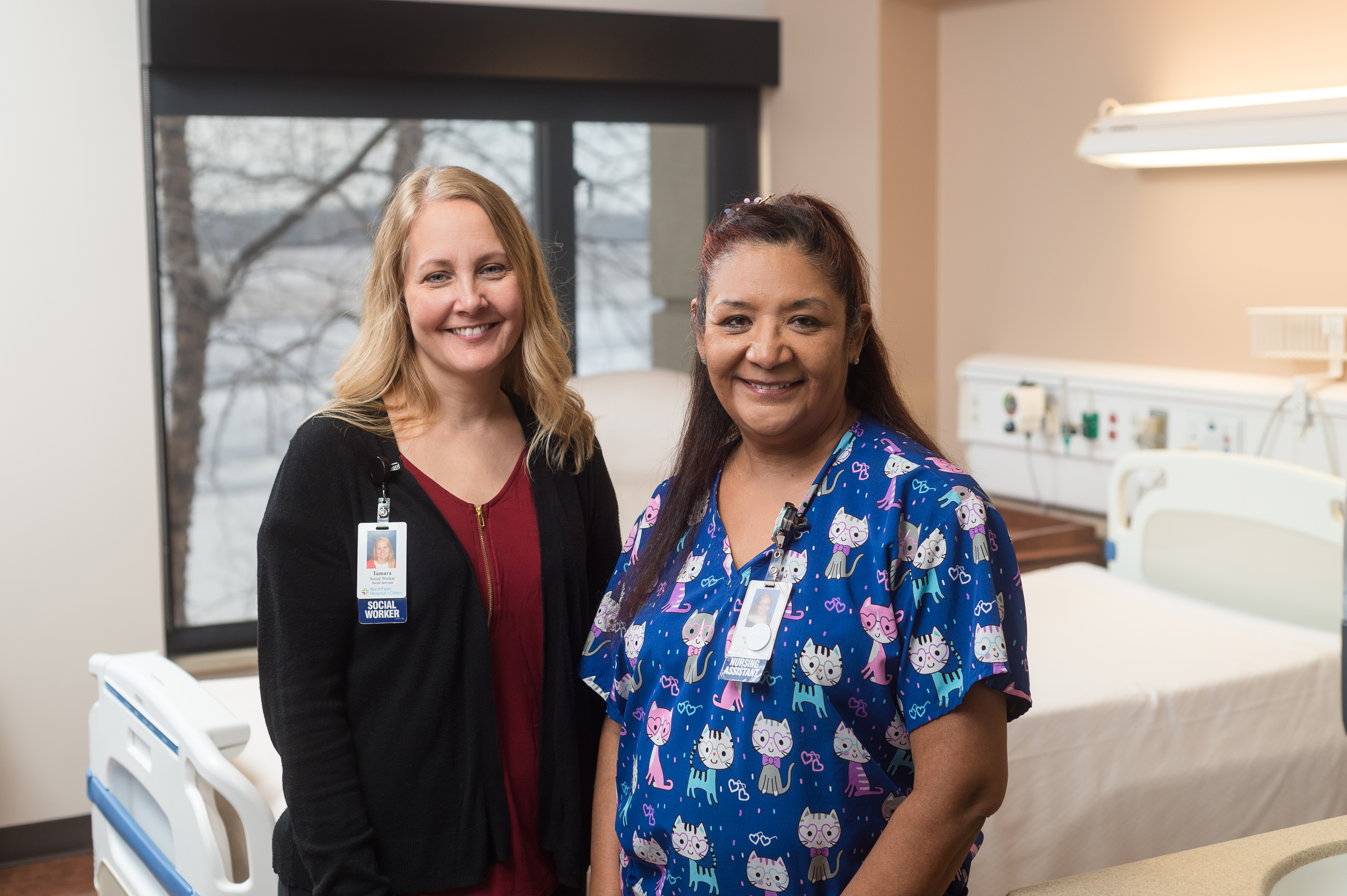 Two nurses standing in a hospital room