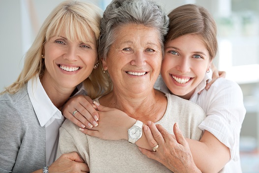 three multigenerational women hugging