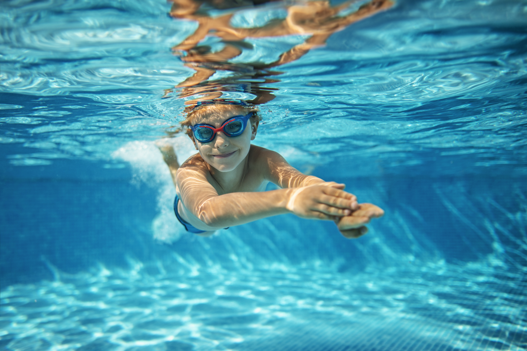 boy swimming in pool