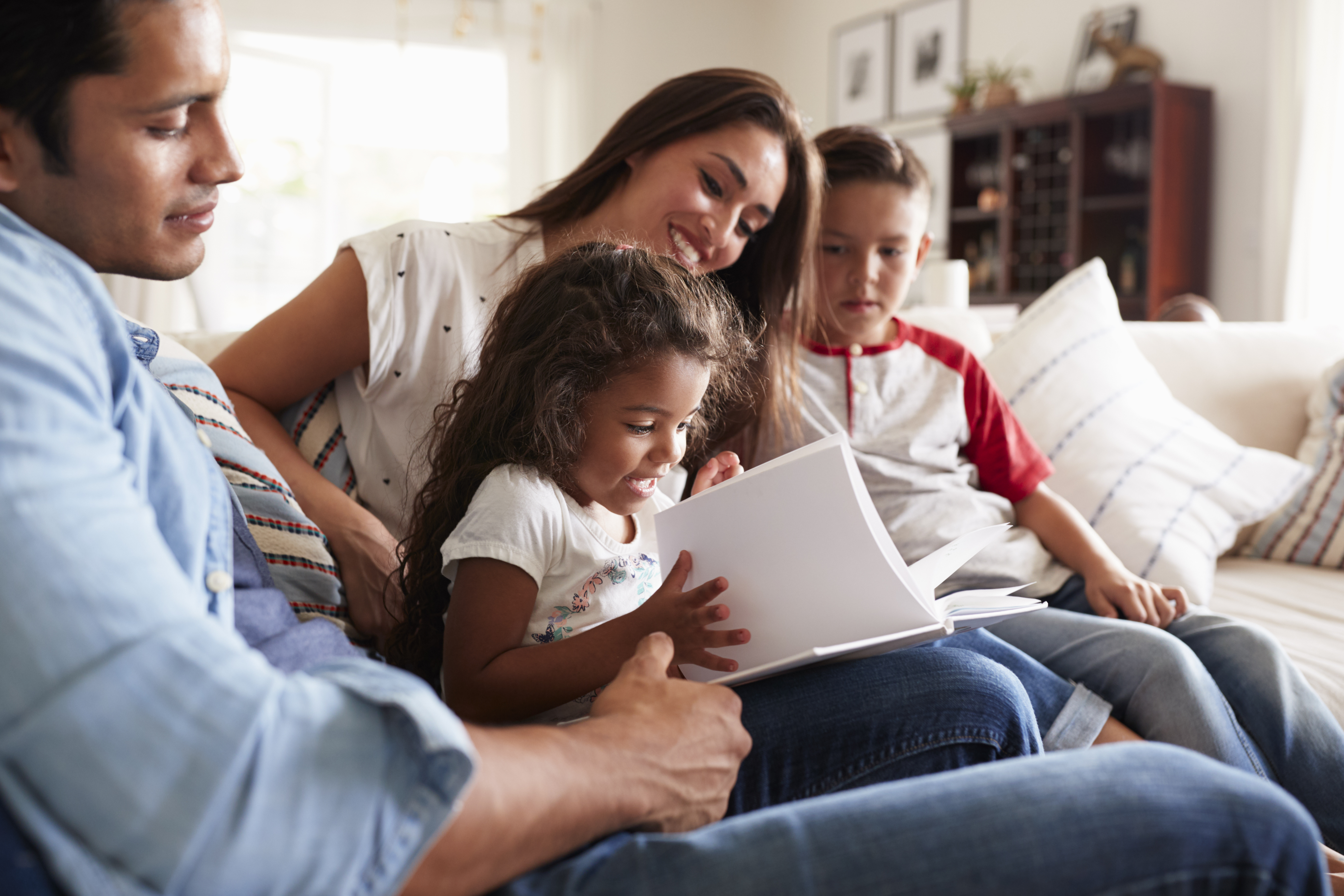 Family sitting on couch 