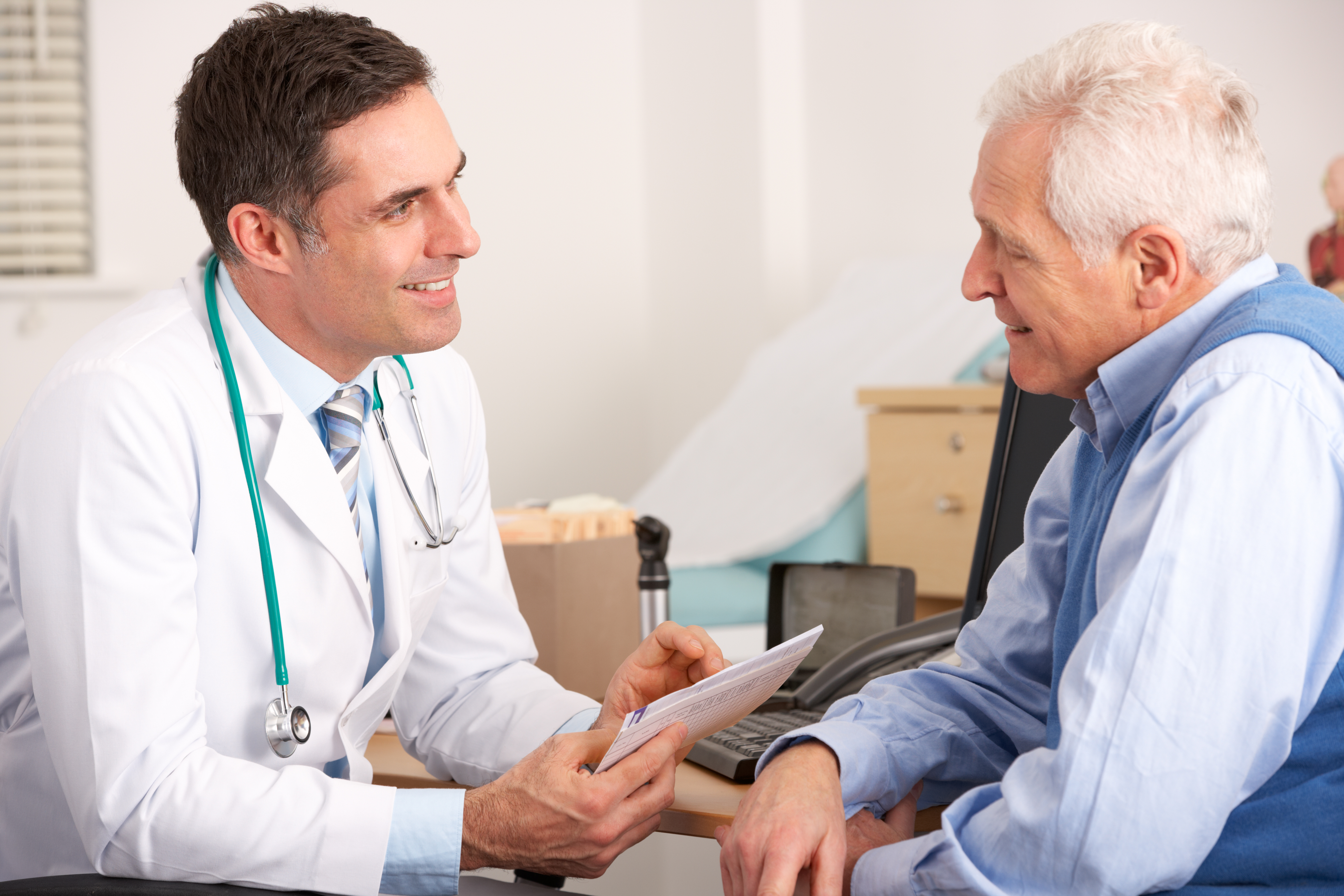Doctor asking older man questions