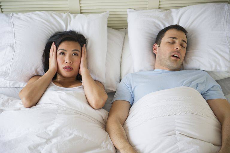 snoring man and awake wife