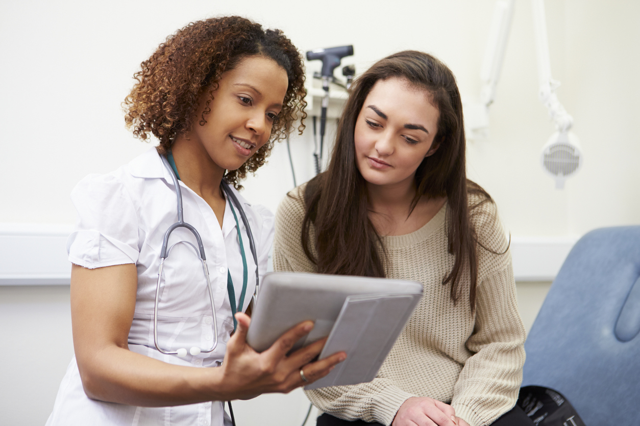 young woman talking to doctor