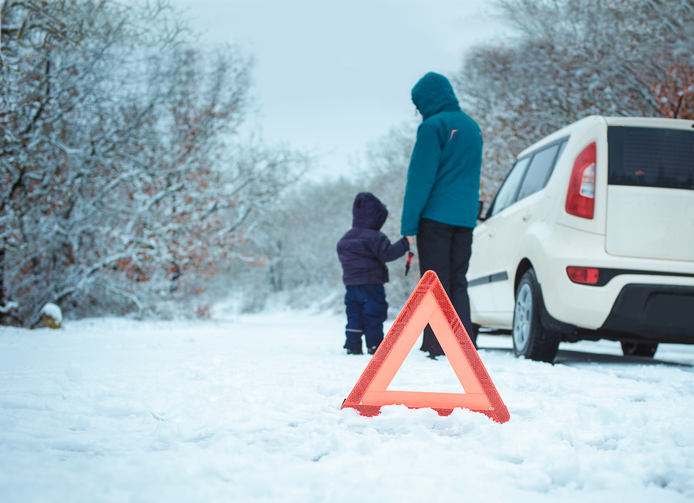Family stranded roadside in winter