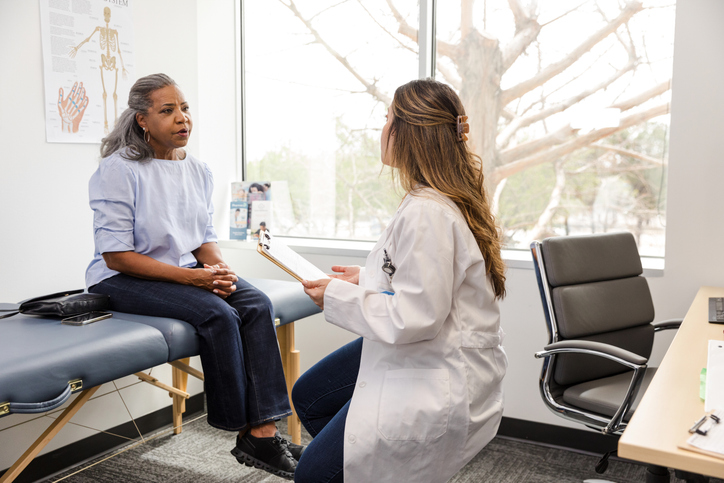 Woman consulting with doctor