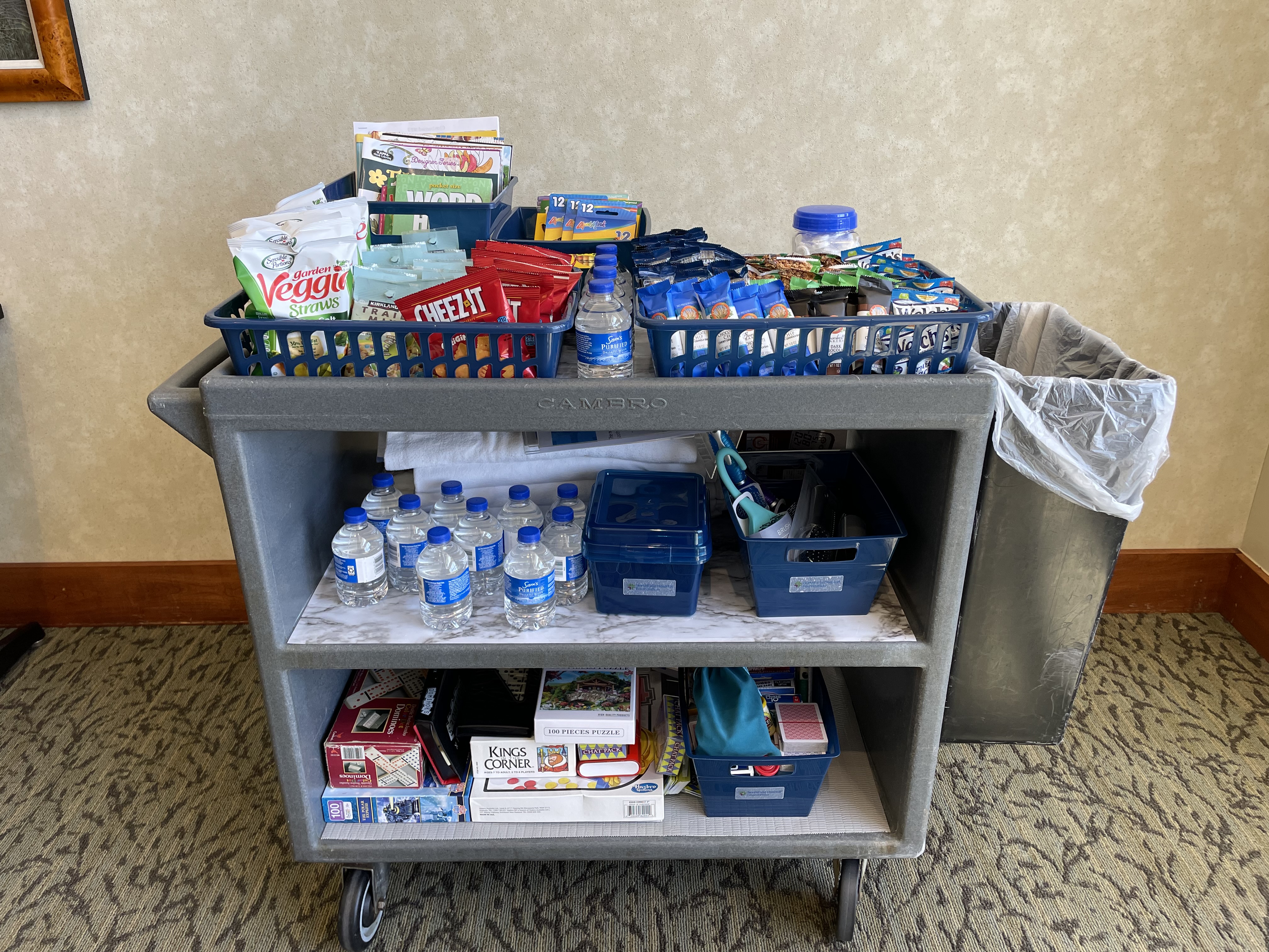 A cart full of snacks and living essentials