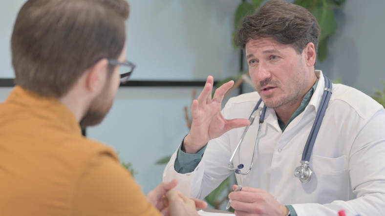 Doctor speaking with man