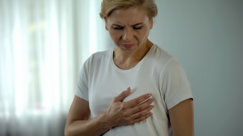 Woman experiencing breast pain