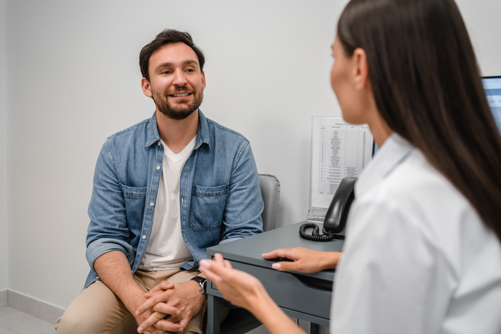 Man discussing vasectomy with doctor