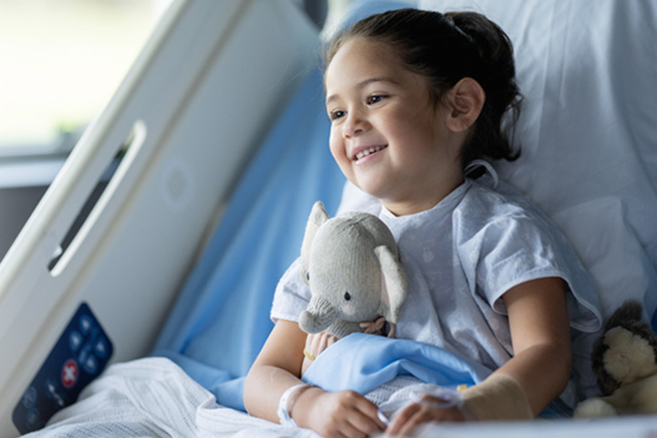 Girl holding stuffed animal