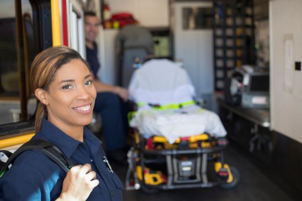Woman EMT smiling at camera