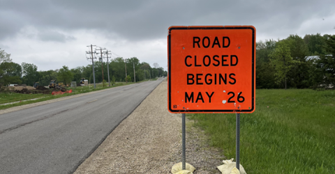 Road sign says "Road Closed starting May 26"