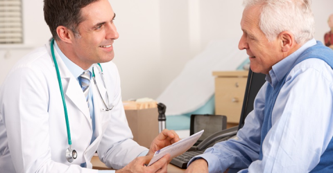 Older man speaks with doctor