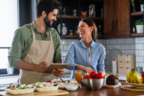 Couple cooking healthy food together
