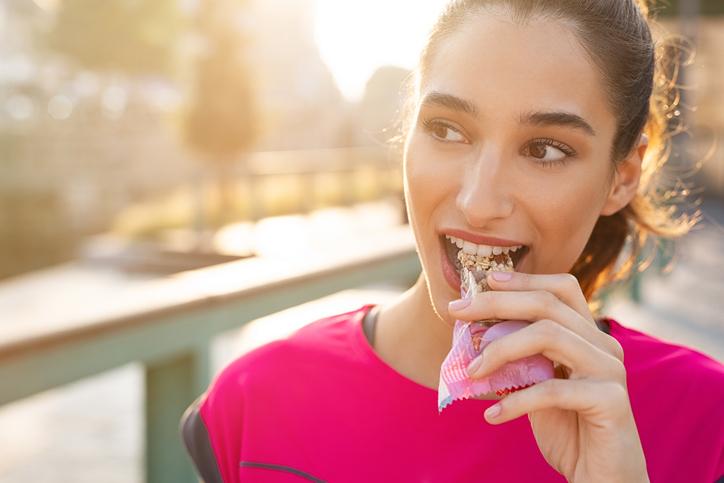 Woman eating energy bar