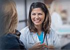 Doctor smiling at patient