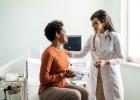 Doctor comforting patient